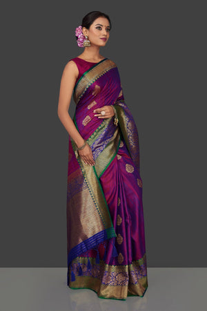 Buy bluish purple tassar Benarasi saree online in USA with antique zari blue-green border and zari buta. Garner compliments on weddings and special occasions with exquisite Banarasi saris, handwoven silk sarees, tussar sarees from Pure Elegance Indian fashion store in USA.-sidepose