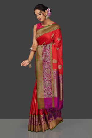 Shop stunning reddish orange tussar Banarasi sari online in USA with pink zari border. Garner compliments on weddings and special occasions with exquisite Banarasi saris, handwoven silk sarees, tussar sarees from Pure Elegance Indian fashion store in USA.-left side