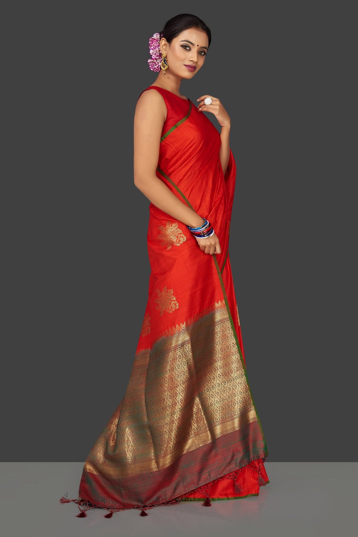 Shop beautiful reddish orange borderless tussar Banarasi sari online in USA with zari buta. Garner compliments on weddings and special occasions with exquisite Banarasi saris, handwoven silk sarees, tussar sarees from Pure Elegance Indian fashion store in USA.-right side