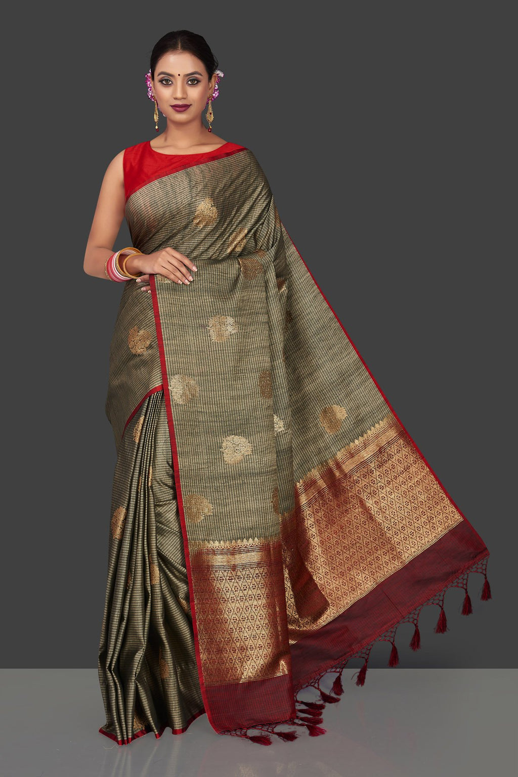 Buy elegant striped grey borderless tussar Banarasi saree online in USA with antique zari buta. Garner compliments on weddings and special occasions with exquisite Banarasi saris, handwoven silk sarees, tussar sarees from Pure Elegance Indian fashion store in USA.-full view