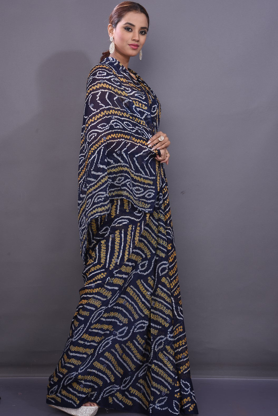 Shop attractive dark blue Bandhej print chiffon sari online in USA. Stand out at weddings and festive occasions with your tasteful choice in this gorgeous chiffon saris,  printed sarees, Bandhej saris, handwoven sarees from Pure Elegance Indian fashion store in USA. right