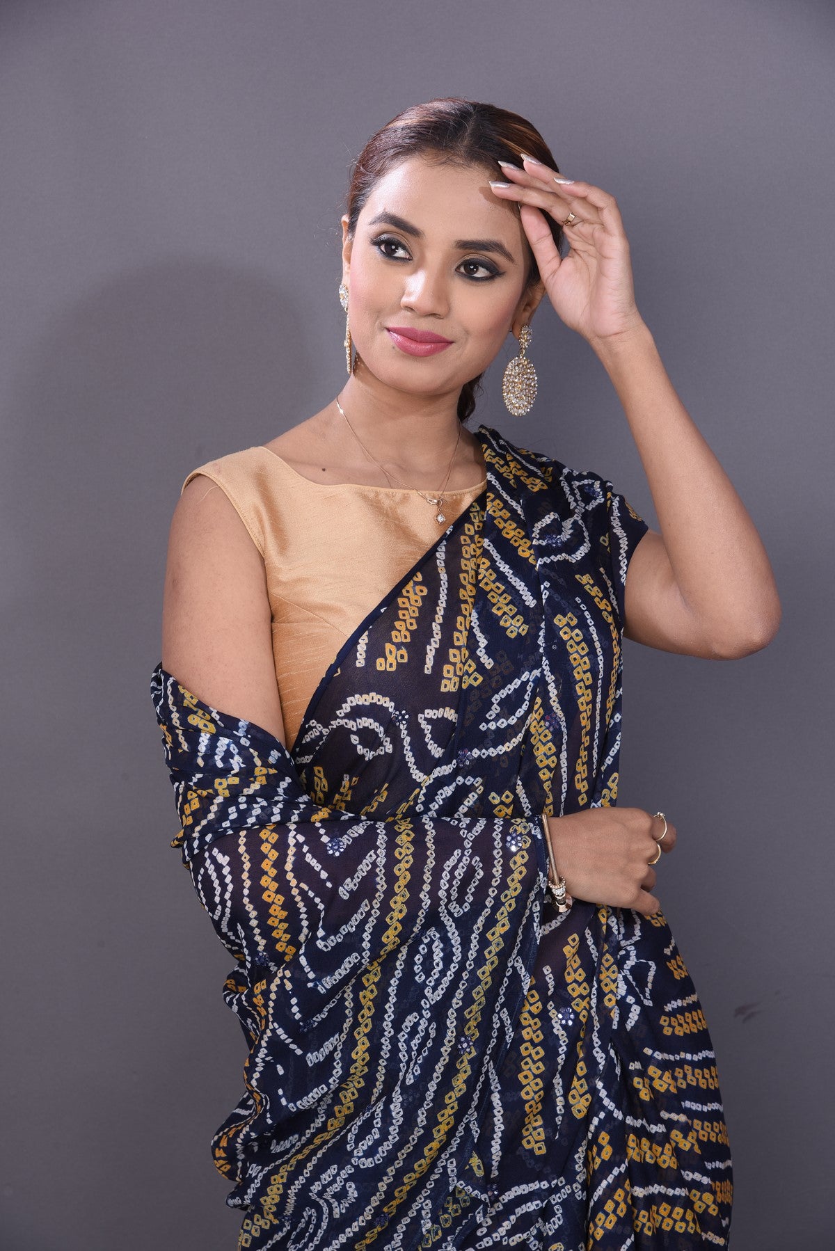 Shop attractive dark blue Bandhej print chiffon sari online in USA. Stand out at weddings and festive occasions with your tasteful choice in this gorgeous chiffon saris,  printed sarees, Bandhej saris, handwoven sarees from Pure Elegance Indian fashion store in USA. -closeup