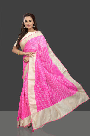 Buy gorgeous pink leheriya print chiffon saree online in USA with cream saree blouse. Shop stunning designer sarees, handwoven sarees, embroidered sarees, printed sarees, pure silk sarees in latest designs from Pure Elegance Indian fashion boutique in USA.-pallu