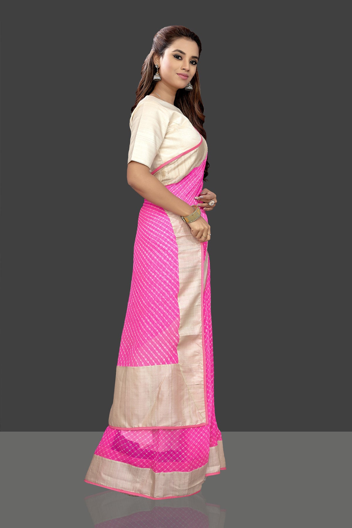 Buy gorgeous pink leheriya print chiffon saree online in USA with cream saree blouse. Shop stunning designer sarees, handwoven sarees, embroidered sarees, printed sarees, pure silk sarees in latest designs from Pure Elegance Indian fashion boutique in USA.-side