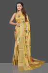 Buy beautiful yellow floral print muga silk saree online in USA with zari border. Make you presence felt with your Indian style on special occasions in beautiful designer sarees, handwoven sarees, muga sarees, tussar silk sarees from Pure Elegance Indian fashion store in USA.-full view