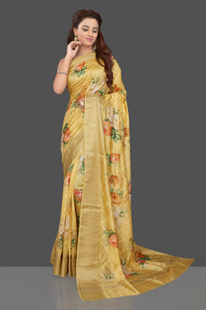 Buy beautiful yellow floral print muga silk saree online in USA with zari border. Make you presence felt with your Indian style on special occasions in beautiful designer sarees, handwoven sarees, muga sarees, tussar silk sarees from Pure Elegance Indian fashion store in USA.-front