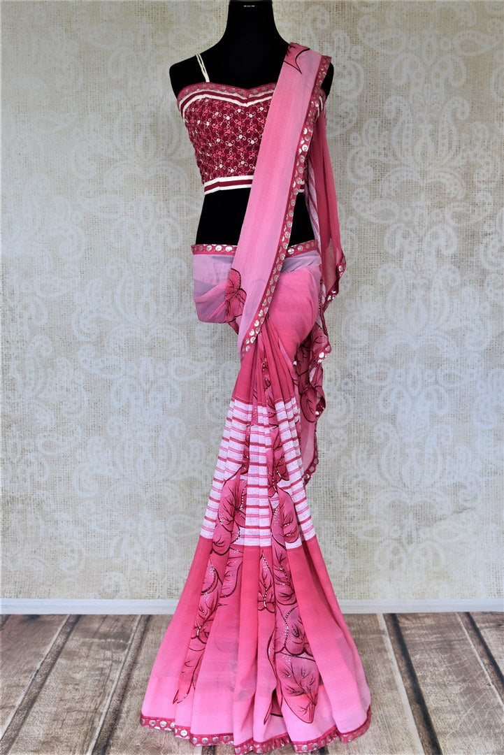 Shop lovely pink leaf print chiffon saree online in USA with strappy blouse. Be the center of attraction at parties and weddings with beautiful georgette sarees, embroidered sarees, printed sarees, Banarasi saris from Pure Elegance Indian fashion store in USA.-full view