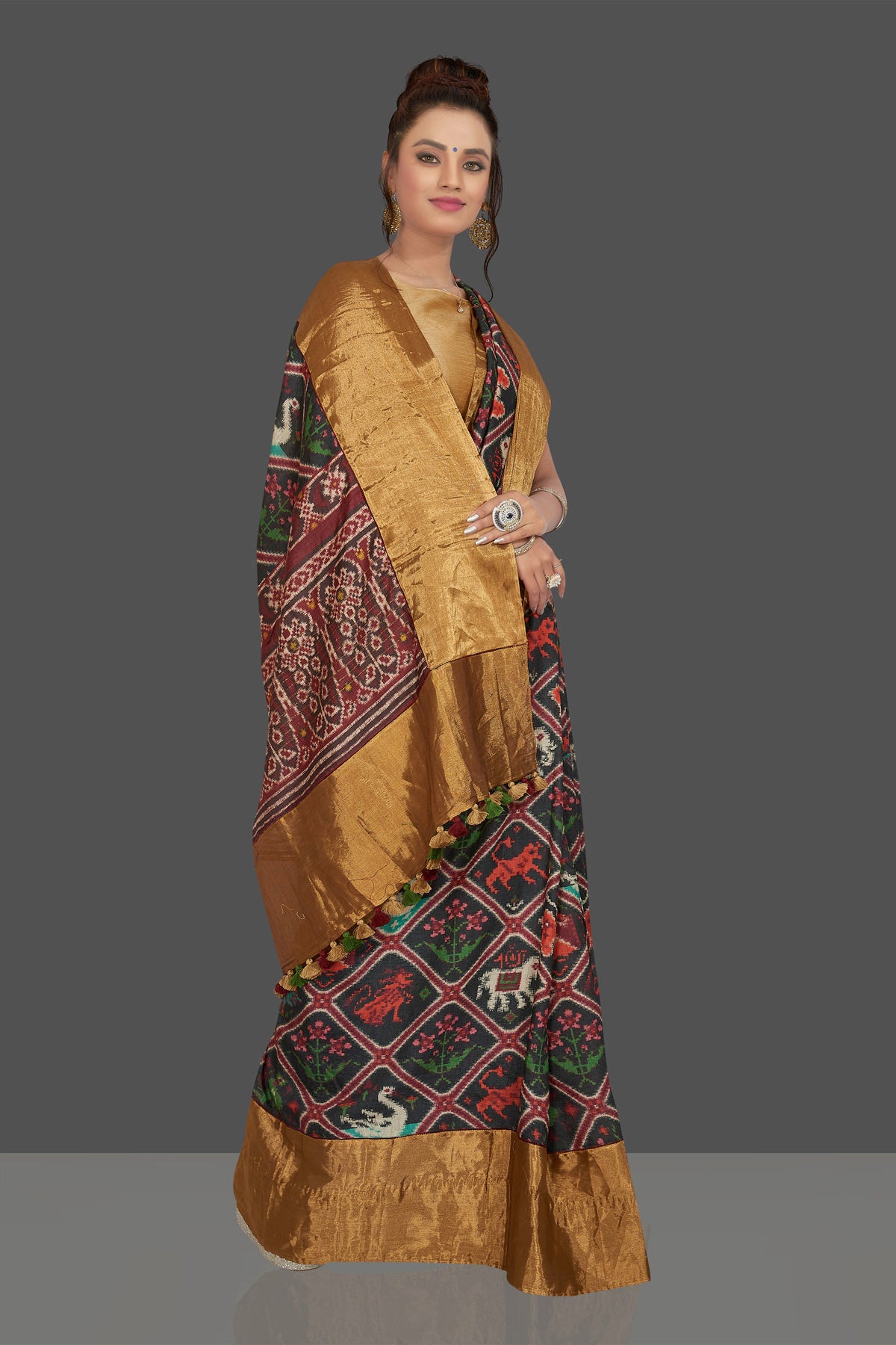 Buy gorgeous black printed Patola tussar saree online in USA with golden border. Shop for weddings and special occasions stunning Banarasi sarees, hand embroidered saris, tussar silk sarees, designer sarees in USA from Pure Elegance Indian clothing store in USA. Shop online now.-full view