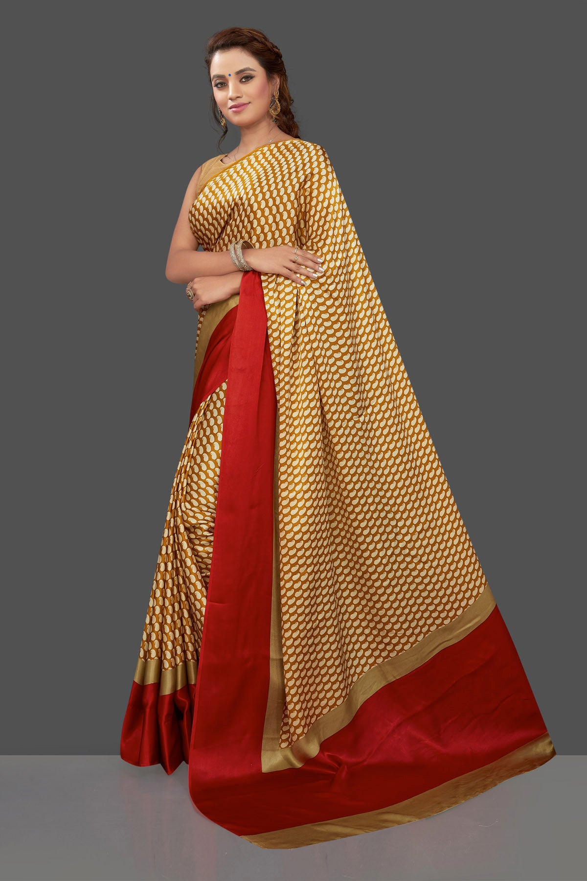 Shop mustard printed crepe silk saree online in USA with solid red border. Elevate your Indian style on special occasions in beautiful designer sarees, crepe silk sarees, georgette saris, printed sarees from Pure Elegance Indian clothing store in USA.-pallu