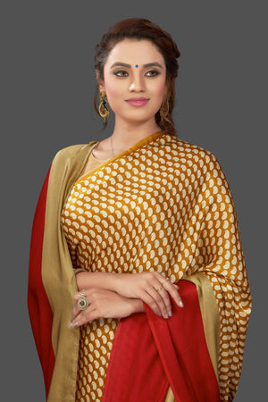 Shop mustard printed crepe silk saree online in USA with solid red border. Elevate your Indian style on special occasions in beautiful designer sarees, crepe silk sarees, georgette saris, printed sarees from Pure Elegance Indian clothing store in USA.-closeup