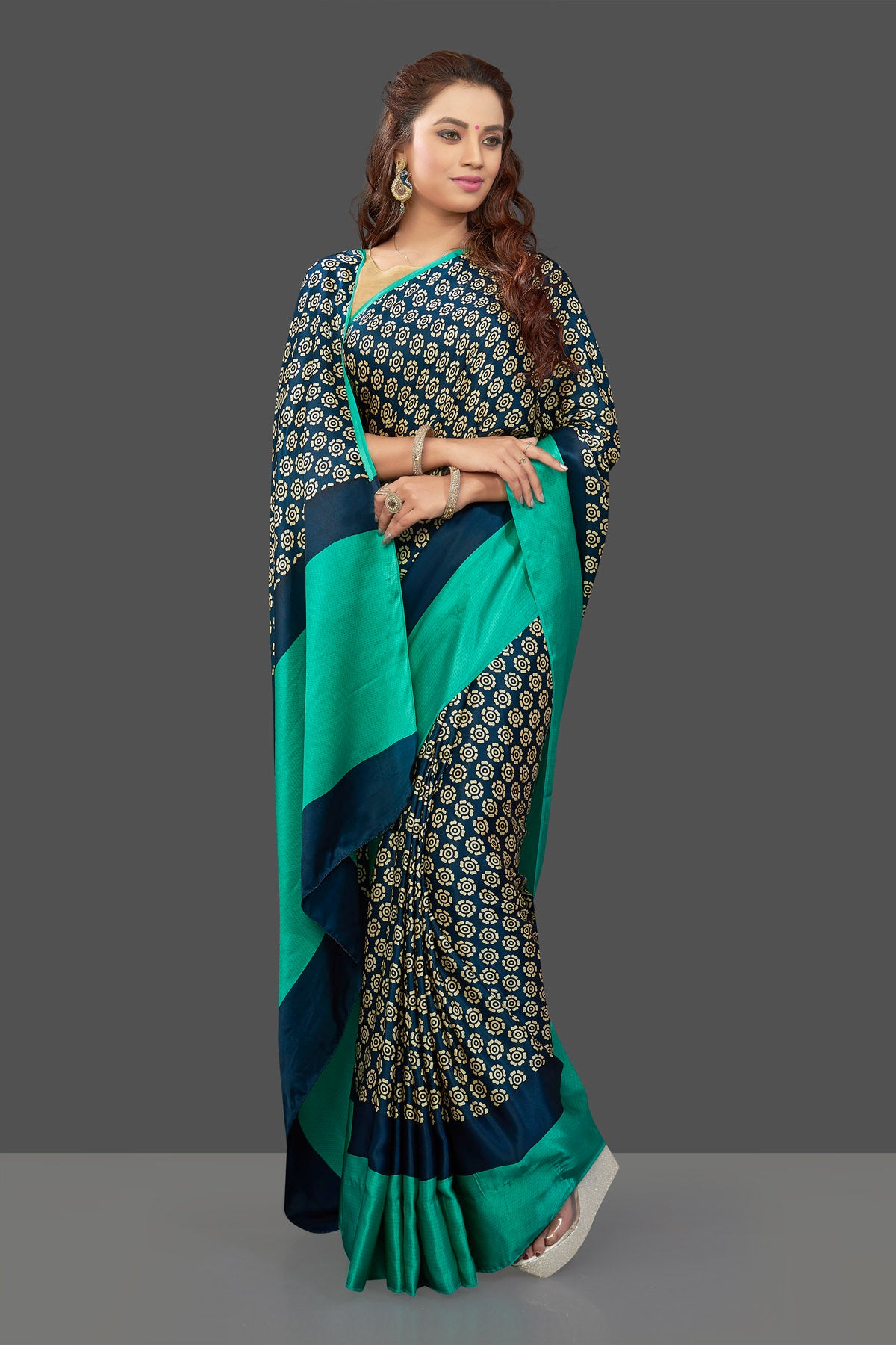 Buy elegant dark blue crepe silk sari online in USA with solid green border. Elevate your Indian style on special occasions in beautiful designer sarees, crepe silk sarees, georgette saris, printed sarees from Pure Elegance Indian clothing store in USA.-front