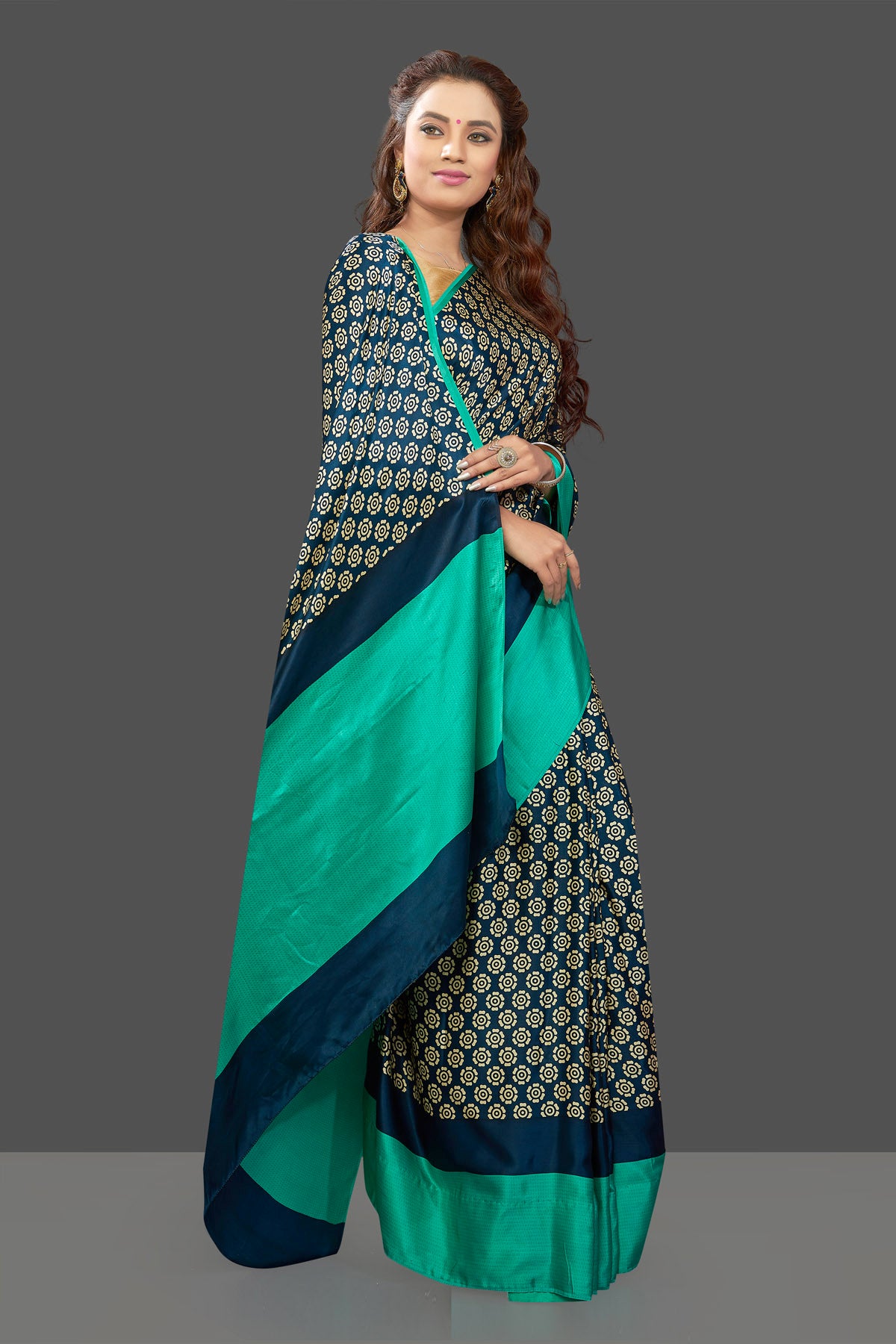 Buy elegant dark blue crepe silk sari online in USA with solid green border. Elevate your Indian style on special occasions in beautiful designer sarees, crepe silk sarees, georgette saris, printed sarees from Pure Elegance Indian clothing store in USA.-full view