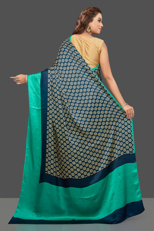 Buy elegant dark blue crepe silk sari online in USA with solid green border. Elevate your Indian style on special occasions in beautiful designer sarees, crepe silk sarees, georgette saris, printed sarees from Pure Elegance Indian clothing store in USA.-back