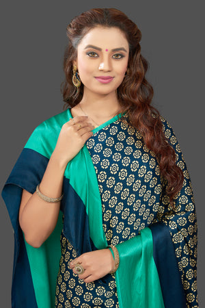 Buy elegant dark blue crepe silk sari online in USA with solid green border. Elevate your Indian style on special occasions in beautiful designer sarees, crepe silk sarees, georgette saris, printed sarees from Pure Elegance Indian clothing store in USA.-closeup