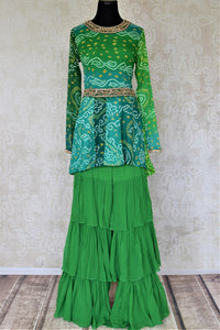 Buy attractive two-tone green silk Bandhej hand embroidered sharara suit online in USA with tiered sharara pants. Elevate your ethnic style on weddings and festive occasions with stunning designer Anarkali suits, sharara suits, palazzo suits, salwar suits from Pure Elegance Indian fashion boutique in USA.-full view