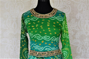 Buy attractive two-tone green silk Bandhej hand embroidered sharara suit online in USA with tiered sharara pants. Elevate your ethnic style on weddings and festive occasions with stunning designer Anarkali suits, sharara suits, palazzo suits, salwar suits from Pure Elegance Indian fashion boutique in USA.-front