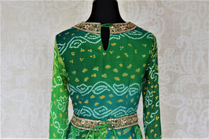 Buy attractive two-tone green silk Bandhej hand embroidered sharara suit online in USA with tiered sharara pants. Elevate your ethnic style on weddings and festive occasions with stunning designer Anarkali suits, sharara suits, palazzo suits, salwar suits from Pure Elegance Indian fashion boutique in USA.-back
