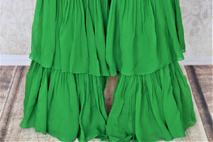 Buy attractive two-tone green silk Bandhej hand embroidered sharara suit online in USA with tiered sharara pants. Elevate your ethnic style on weddings and festive occasions with stunning designer Anarkali suits, sharara suits, palazzo suits, salwar suits from Pure Elegance Indian fashion boutique in USA.-pants