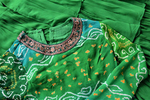 Buy attractive two-tone green silk Bandhej hand embroidered sharara suit online in USA with tiered sharara pants. Elevate your ethnic style on weddings and festive occasions with stunning designer Anarkali suits, sharara suits, palazzo suits, salwar suits from Pure Elegance Indian fashion boutique in USA.-closeup