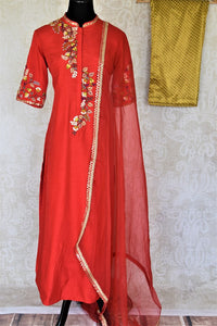 Buy elegant red embroidered silk suit online in USA with mustard pants and matching red dupatta. Elevate your ethnic style on weddings and festive occasions with stunning designer Anarkali suits, sharara suits, palazzo suits, salwar suits from Pure Elegance Indian fashion boutique in USA.-full view