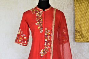 Buy elegant red embroidered silk suit online in USA with mustard pants and matching red dupatta. Elevate your ethnic style on weddings and festive occasions with stunning designer Anarkali suits, sharara suits, palazzo suits, salwar suits from Pure Elegance Indian fashion boutique in USA.-front