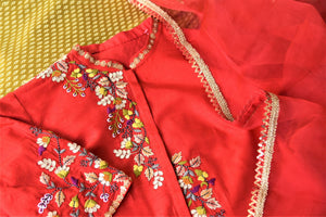Buy elegant red embroidered silk suit online in USA with mustard pants and matching red dupatta. Elevate your ethnic style on weddings and festive occasions with stunning designer Anarkali suits, sharara suits, palazzo suits, salwar suits from Pure Elegance Indian fashion boutique in USA.-closeup