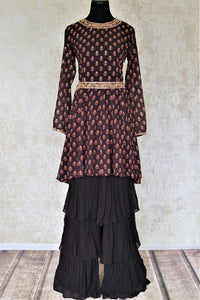 Shop gorgeous black floral print embroidered silk sharara suit online in USA with tiered sharara pants. Elevate your ethnic style on weddings and festive occasions with stunning designer Anarkali suits, sharara suits, palazzo suits, salwar suits from Pure Elegance Indian fashion boutique in USA.-full view