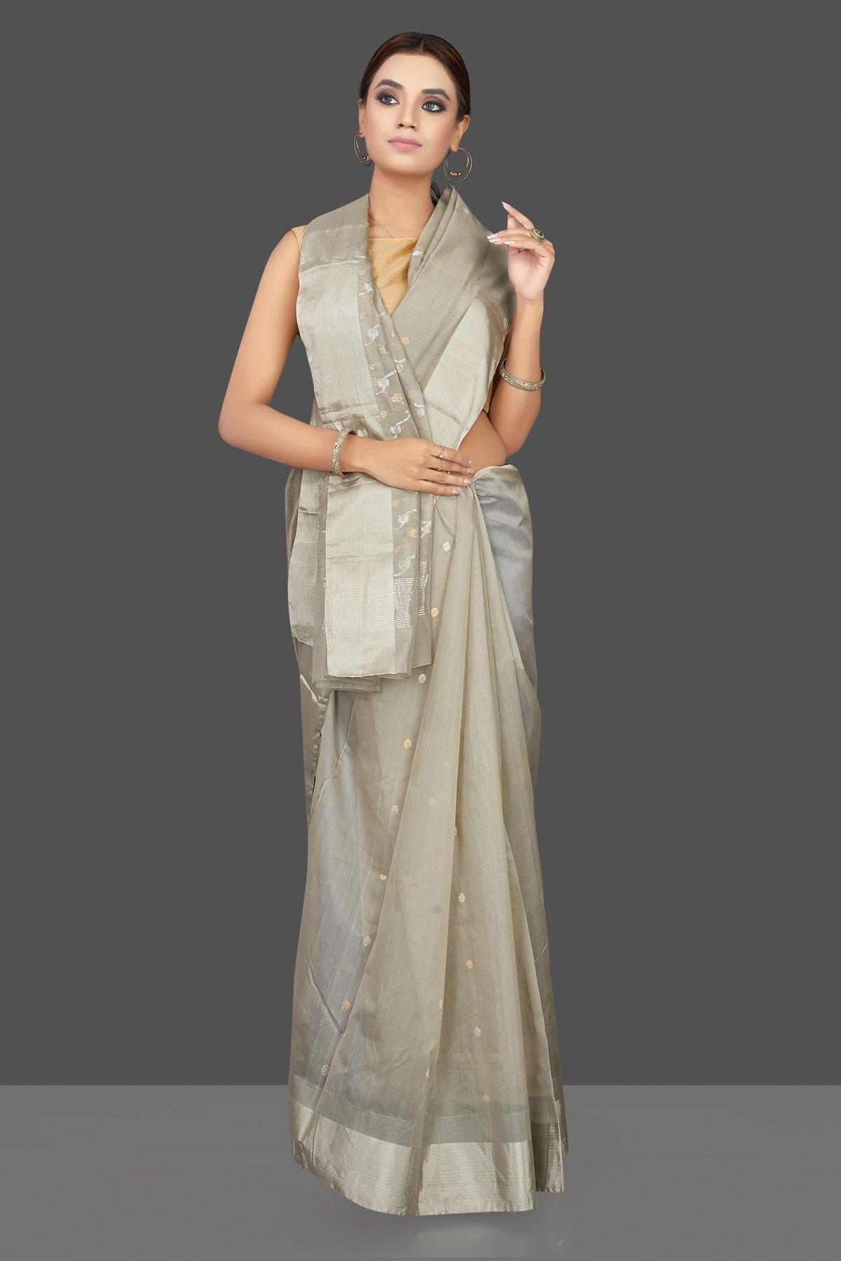 Shop attractive light grey Chanderi silk saree online in USA with silver zari border. Flaunt Indian fashion on special occasions in gorgeous chanderi sarees, pure silk sarees, Banarasi sarees, zari work sarees from Pure Elegance Indian fashion boutique in USA.-front