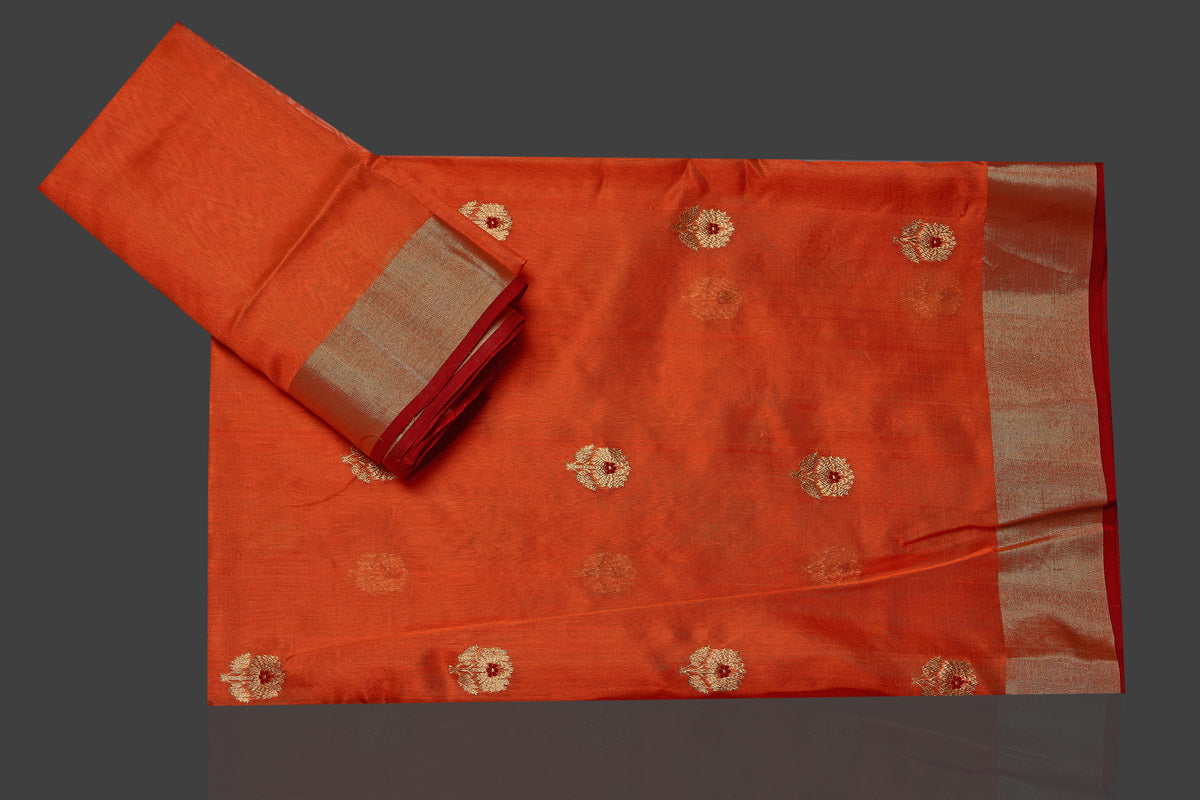 Buy stunning orange color chanderi silk sari online in USA with golden zari minakari flower buta and golden zari border. Flaunt Indian fashion on special occasions in gorgeous chanderi sarees, pure silk sarees, Banarasi sarees, zari work sarees from Pure Elegance Indian fashion boutique in USA.-blouse