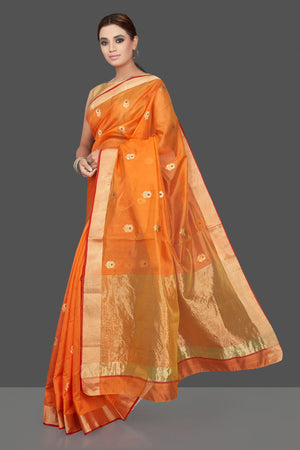 Buy stunning orange color chanderi silk sari online in USA with golden zari minakari flower buta and golden zari border. Flaunt Indian fashion on special occasions in gorgeous chanderi sarees, pure silk sarees, Banarasi sarees, zari work sarees from Pure Elegance Indian fashion boutique in USA.-pallu
