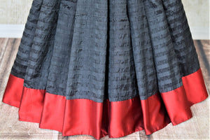 Buy black Bengal tangail silk sari online in USA with red border. Shop beautiful silk saris, pure zari silk saris, handwoven sarees in USA from Pure Elegance Indian fashion store in USA. Shop online now.-pleats
