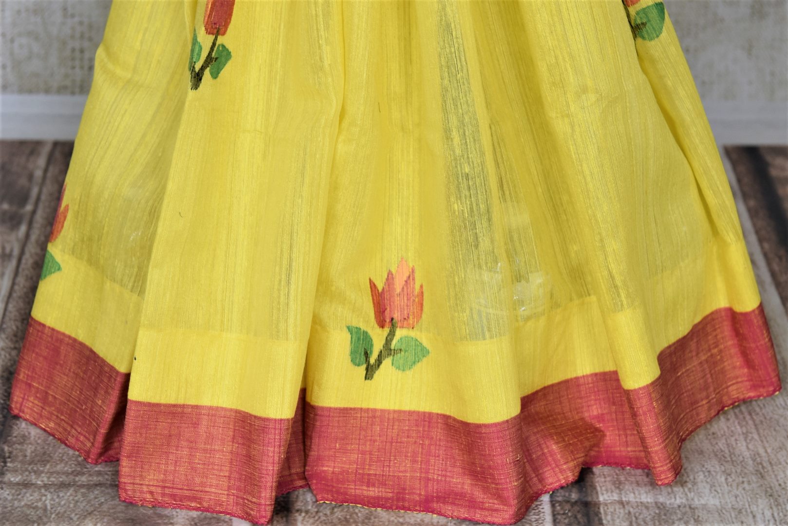 Shop gorgeous yellow matka silk saree online in USA with pink border. Shop handowoven silk sarees, designer saris, linen sarees, embroidered sarees in USA from Pure Elegance Indian saree store in USA.-pleats