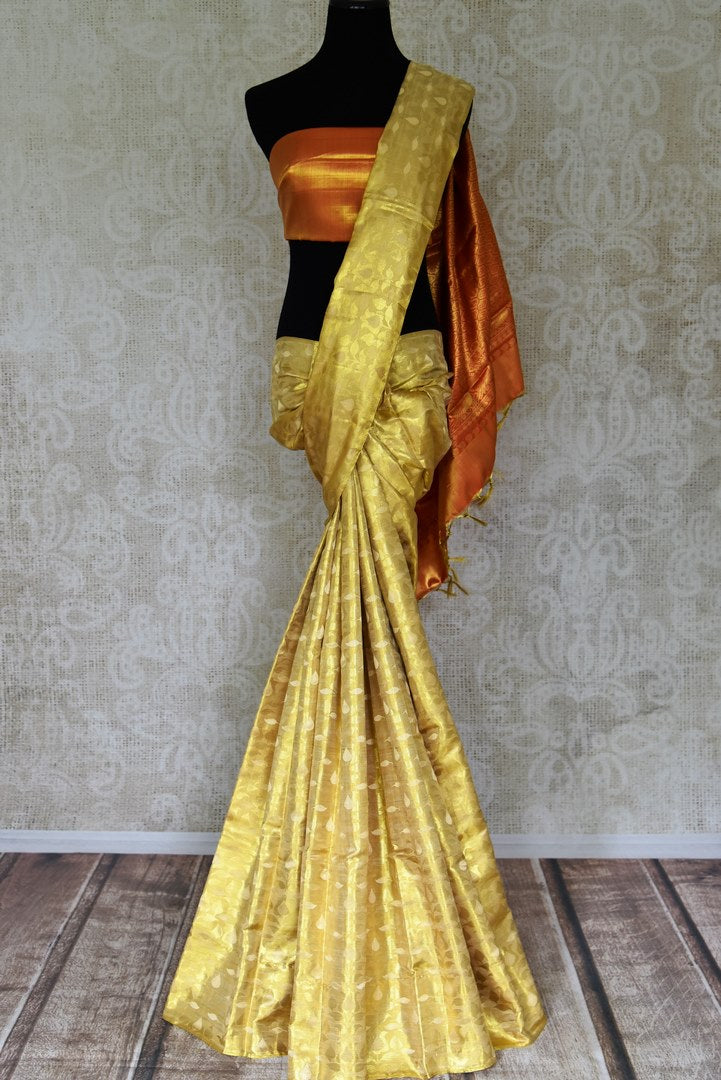 Buy beautiful cream and golden Kanjeevaram sari online in USA with red zari pallu. Look beautiful on special occasions with beautiful Kanjivaram silk sarees, pure silk saris, soft silk sarees, handwoven silk sarees in from Pure Elegance Indian saree store in USA.-full view