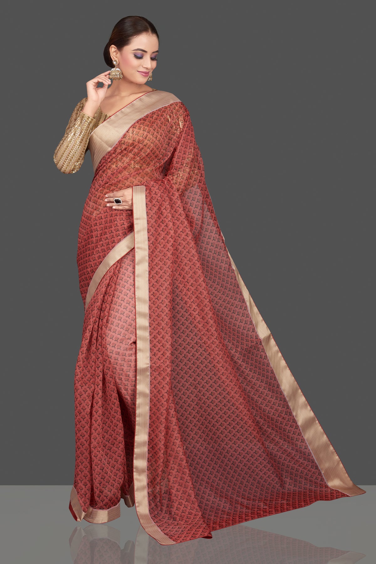 Buy red printed organza sari online in USA with golden sari blouse. Look glamorous at parties and weddings in stunning designer sarees, embroidered sareees, fancy sarees, Bollywood sarees from Pure Elegance Indian saree store in USA.-full view
