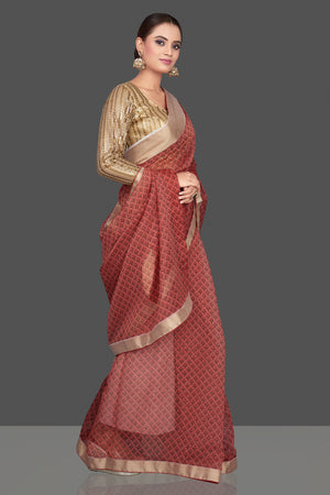Buy red printed organza sari online in USA with golden sari blouse. Look glamorous at parties and weddings in stunning designer sarees, embroidered sareees, fancy sarees, Bollywood sarees from Pure Elegance Indian saree store in USA.-side