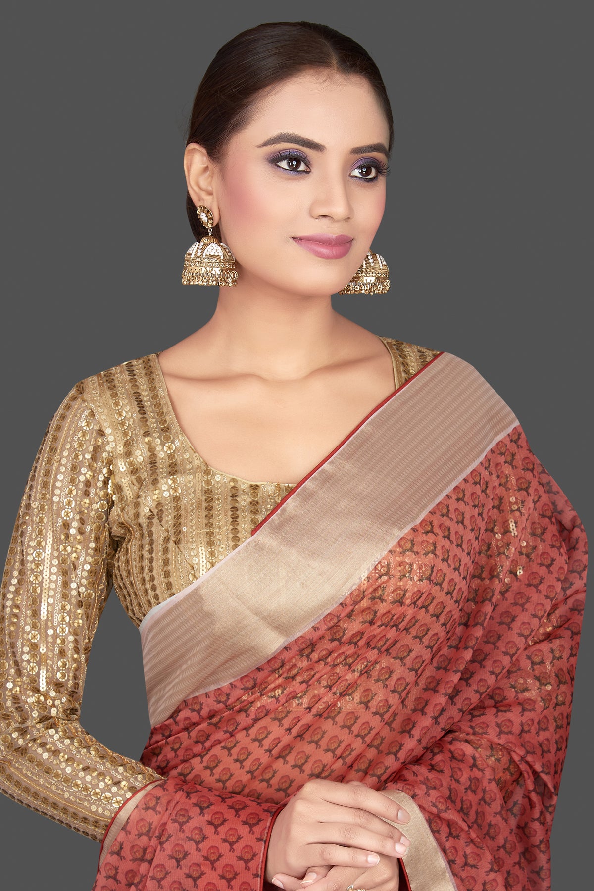 Buy red printed organza sari online in USA with golden sari blouse. Look glamorous at parties and weddings in stunning designer sarees, embroidered sareees, fancy sarees, Bollywood sarees from Pure Elegance Indian saree store in USA.-closeup