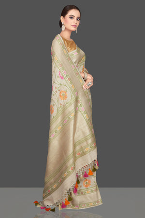 Shop stunning cream floral tussar georgette saree online in USA. Look gorgeous on special occasions with exquisite Indian sarees, handwoven sarees, Banarasi sarees, pure silk sarees from Pure Elegance Indian saree store in USA.-side