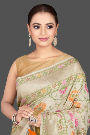 Shop stunning cream floral tussar georgette saree online in USA. Look gorgeous on special occasions with exquisite Indian sarees, handwoven sarees, Banarasi sarees, pure silk sarees from Pure Elegance Indian saree store in USA.-closeup