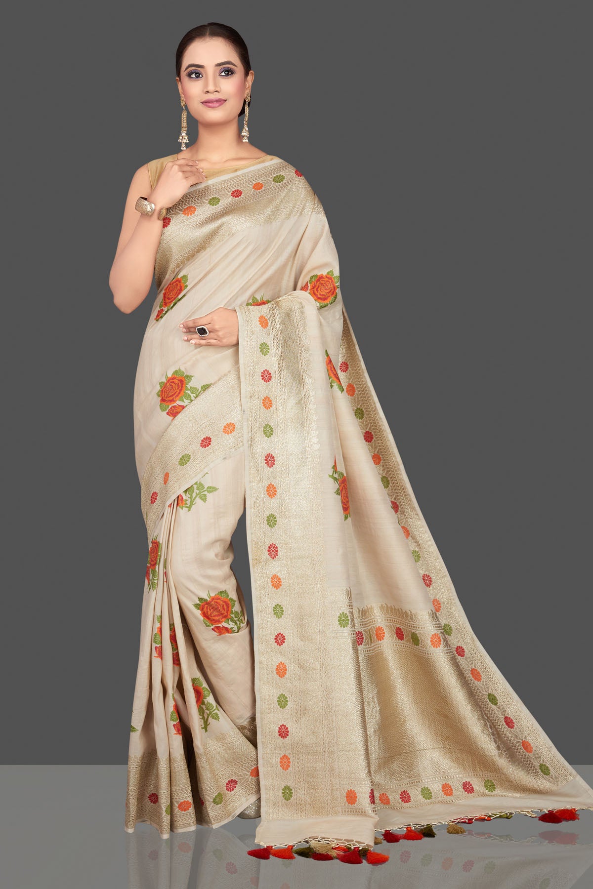 Buy beautiful off-white tussar georgette saree online in USA with zari border. Look gorgeous on special occasions with exquisite Indian sarees, handwoven sarees, Banarasi sarees, pure silk sarees from Pure Elegance Indian saree store in USA.-full view