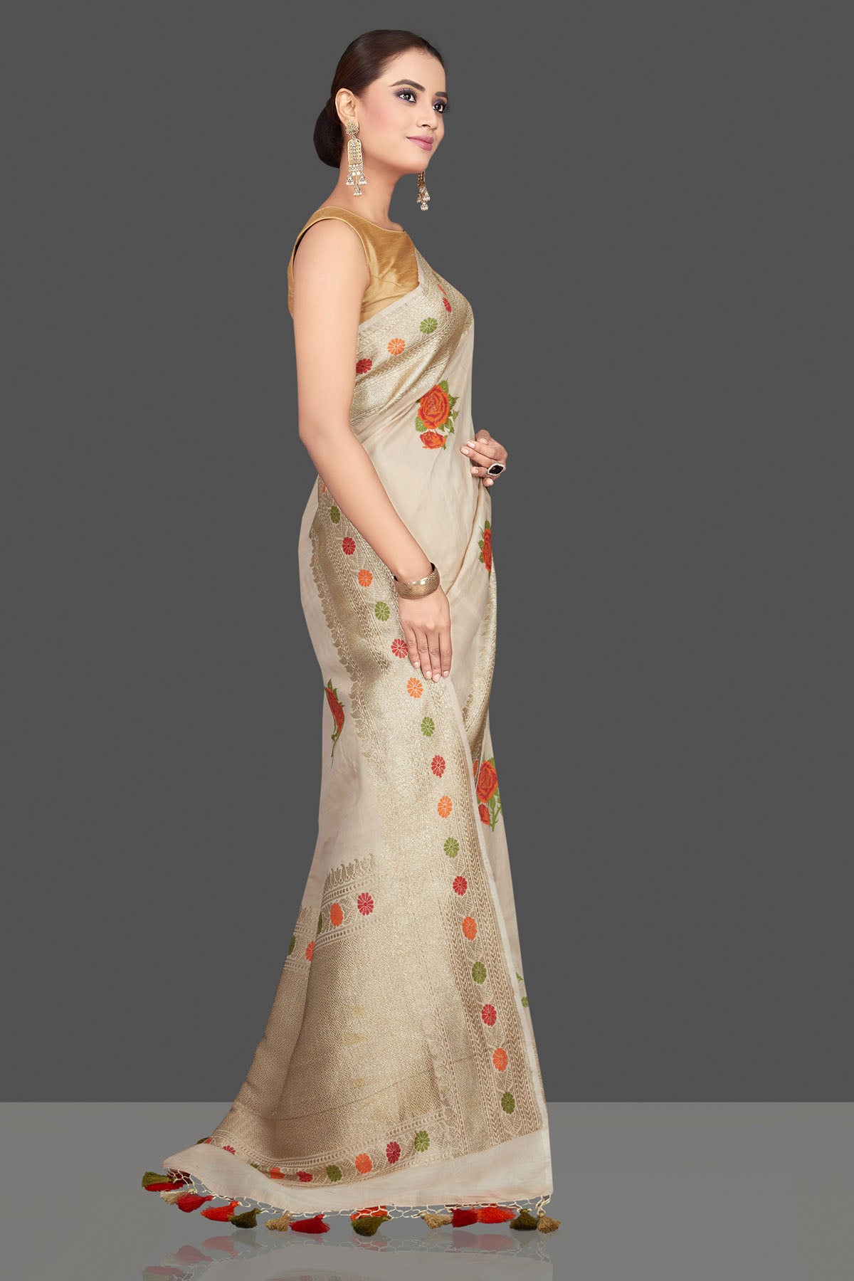 Buy beautiful off-white tussar georgette saree online in USA with zari border. Look gorgeous on special occasions with exquisite Indian sarees, handwoven sarees, Banarasi sarees, pure silk sarees from Pure Elegance Indian saree store in USA.-side
