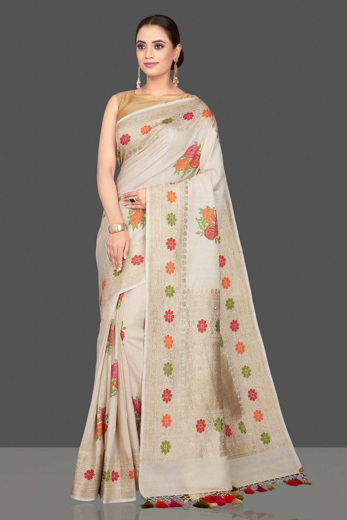 Buy gorgeous cream tussar georgette saree online in USA with floral weave buta and zari border. Look gorgeous on special occasions with exquisite Indian sarees, handwoven sarees, Banarasi sarees, pure silk sarees from Pure Elegance Indian saree store in USA.-front