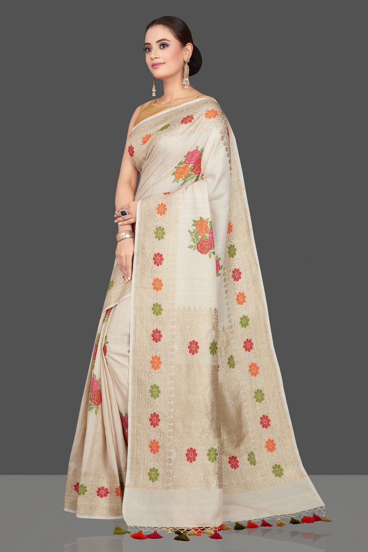 Buy gorgeous cream tussar georgette saree online in USA with floral weave buta and zari border. Look gorgeous on special occasions with exquisite Indian sarees, handwoven sarees, Banarasi sarees, pure silk sarees from Pure Elegance Indian saree store in USA.-full view