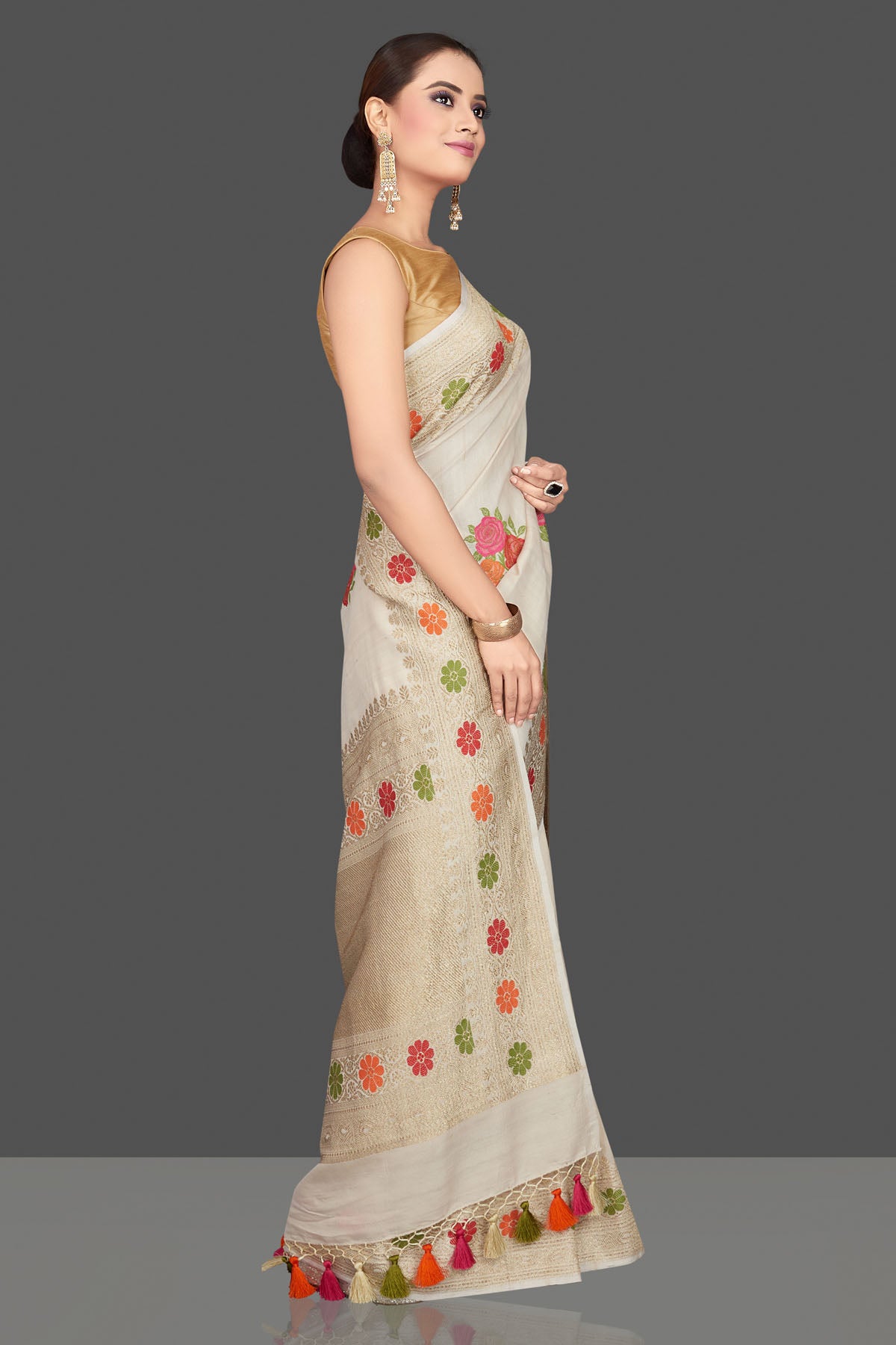 Buy gorgeous cream tussar georgette saree online in USA with floral weave buta and zari border. Look gorgeous on special occasions with exquisite Indian sarees, handwoven sarees, Banarasi sarees, pure silk sarees from Pure Elegance Indian saree store in USA.-side