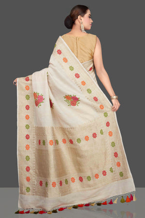 Buy gorgeous cream tussar georgette saree online in USA with floral weave buta and zari border. Look gorgeous on special occasions with exquisite Indian sarees, handwoven sarees, Banarasi sarees, pure silk sarees from Pure Elegance Indian saree store in USA.-back