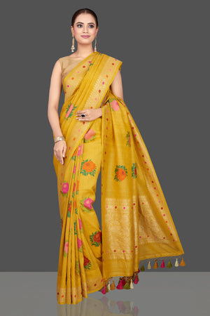 Buy beautiful yellow tussar georgette sari online in USA with floral weave buta and zari border. Look gorgeous on special occasions with exquisite Indian sarees, handwoven sarees, Banarasi sarees, pure silk sarees from Pure Elegance Indian saree store in USA.-front
