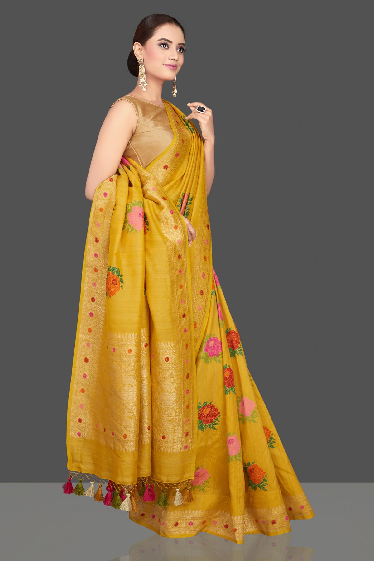 Buy beautiful yellow tussar georgette sari online in USA with floral weave buta and zari border. Look gorgeous on special occasions with exquisite Indian sarees, handwoven sarees, Banarasi sarees, pure silk sarees from Pure Elegance Indian saree store in USA.-side