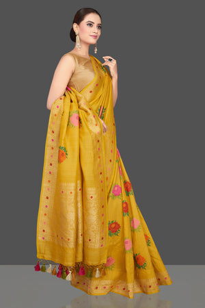 Buy beautiful yellow tussar georgette sari online in USA with floral weave buta and zari border. Look gorgeous on special occasions with exquisite Indian sarees, handwoven sarees, Banarasi sarees, pure silk sarees from Pure Elegance Indian saree store in USA.-side