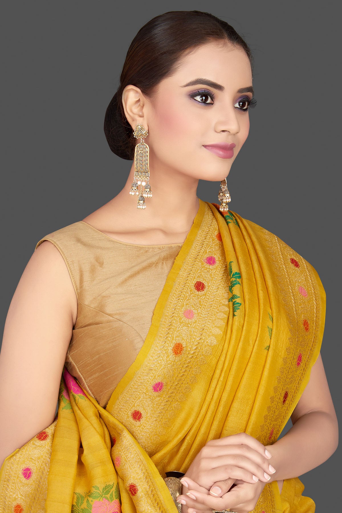 Buy beautiful yellow tussar georgette sari online in USA with floral weave buta and zari border. Look gorgeous on special occasions with exquisite Indian sarees, handwoven sarees, Banarasi sarees, pure silk sarees from Pure Elegance Indian saree store in USA.-closeup