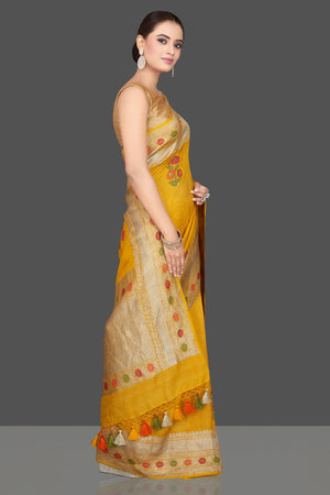 Buy gorgeous mustard tussar georgette sari online in USA with floral weave buta and zari border. Look gorgeous on special occasions with exquisite Indian sarees, handwoven sarees, Banarasi sarees, pure silk sarees from Pure Elegance Indian saree store in USA.-side
