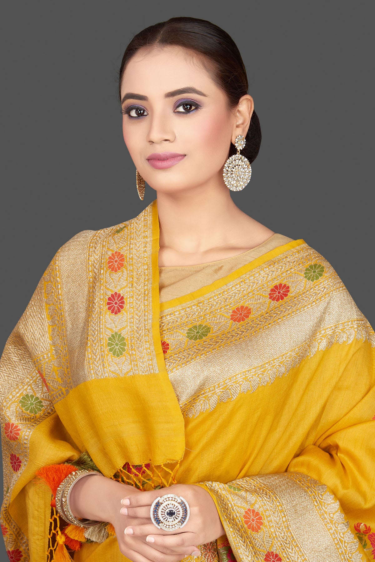 Buy gorgeous mustard tussar georgette sari online in USA with floral weave buta and zari border. Look gorgeous on special occasions with exquisite Indian sarees, handwoven sarees, Banarasi sarees, pure silk sarees from Pure Elegance Indian saree store in USA.-closeup